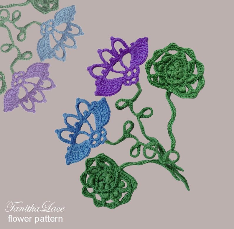 May include: Crocheted flower pattern in shades of blue, purple, and green. The flowers have intricate openwork designs and are connected by green stems. The text "Tanitka Lace flower pattern" is in the lower left corner.