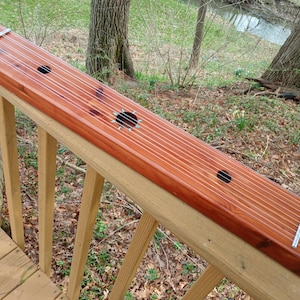 Aeolian Window Harp all solid Aromatic cedar swirly grain with Natural Blue Turquoise Sun inlay contrasts nicely with the wood tones