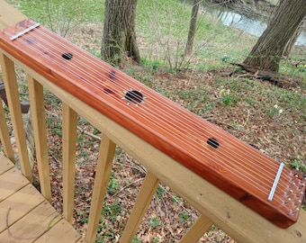 Aeolian Window Harp all solid Aromatic cedar swirly grain with Natural Blue Turquoise Sun inlay contrasts nicely with the wood tones