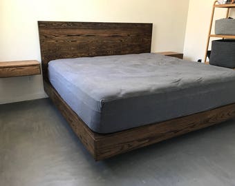 May include: A dark wood platform bed frame with a gray mattress and a matching dark wood nightstand. The bed frame is raised off the ground and has a simple, modern design.