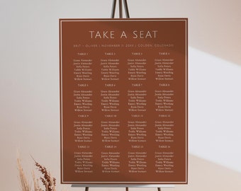Puede incluir: Un diagrama de asientos marrón con texto blanco en un caballete. El diagrama se titula "Take a Seat" y enumera los nombres de los invitados para una boda. La boda es para Brit y Oliver, el 11 de noviembre de 2023, en Golden, Colorado.