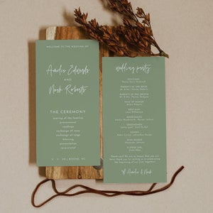 May include: A green wedding ceremony programme with the names Andir Edwards and Noch Roberts, the date 11-11-XX, and the location BOONE, NC. The programme lists the order of events for the ceremony. A second green card lists the wedding party with the names of the officiant, parents of the bride and groom, maid of honour, best man, bridesmaids, groomsmen, ushers, ring bearer, and flower girl. The text "Thank you! We are so happy that you are here! Thank you for joining us in celebrating the beginning of our lives together!" is included at the bottom of the card.