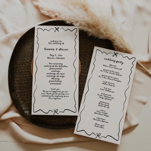 May include: A wedding ceremony program with black text on white paper. The program includes the wedding date, location, and a list of the wedding party members. The program is on a brown plate with a dried flower.