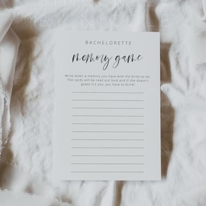 May include: A white card with black text that reads "Bachelorette Memory Game". The card has instructions to write down a memory with the bride-to-be and to read the memories out loud. If the bride-to-be doesn't guess who wrote the memory, that person has to drink.