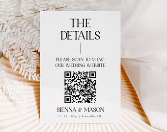 May include: A white card with black text that reads "THE DETAILS" and "PLEASE SCAN TO VIEW OUR WEDDING WEBSITE". A black and white QR code is below the text. The text "SIENNA & MASON" is below the QR code, followed by the date "11-13 20xx" and the location "Asheville, NC".