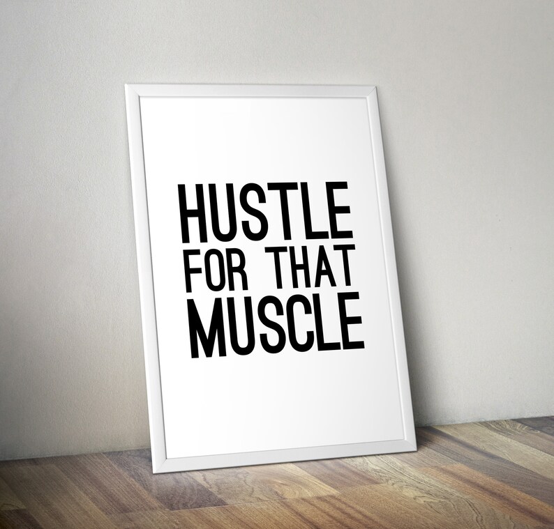 May include: White framed motivational poster with black text that reads "Hustle for that Muscle".