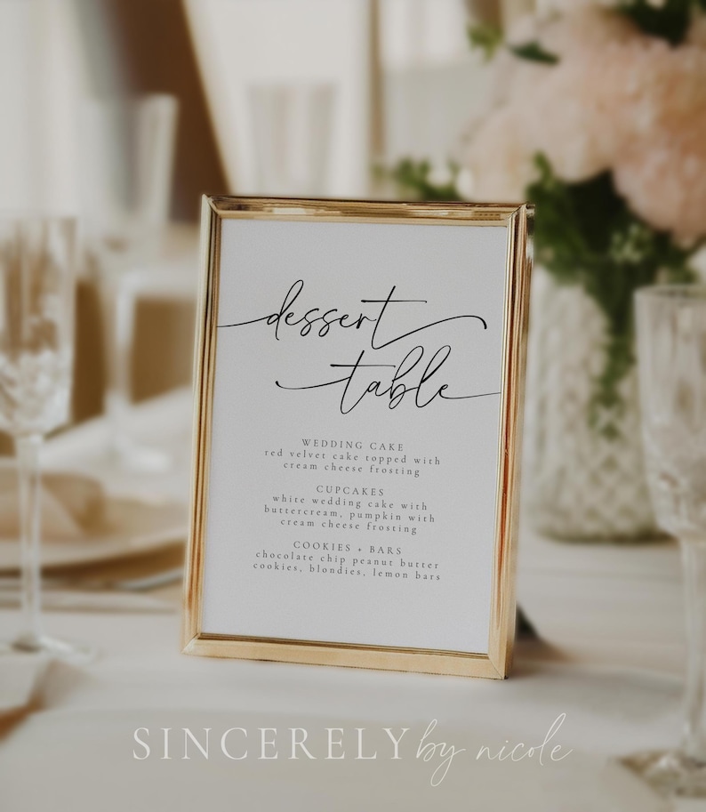 Chic dessert table signage with a contemporary script design, outlining a sweet selection including wedding cake, cupcakes, and cookies. Designed for receptions, celebrations, or stylish events seeking a refined detail.