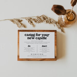 May include: A wooden sign with the text "caring for your new candle" and instructions on how to care for a candle. The sign is on a white background with dried grass and a glass jar.