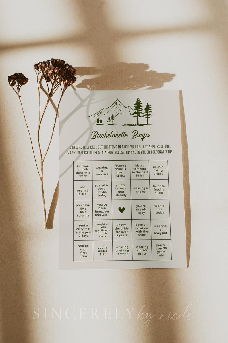 A bachelorette bingo game card styled in warm sunlight with dried floral accents. This interactive game encourages guests to mark off fun and memorable experiences, ideal for bridal parties with a natural or boho theme.
