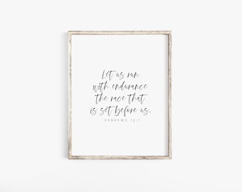 May include: A white framed print with a black and white inspirational quote from Hebrews 12:1. The quote reads "Let us run with endurance the race that is set before us."