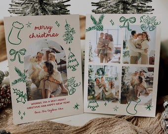 May include: Two Christmas cards with family photos and green and red festive illustrations. One card reads "merry christmas" and "Wishing you a very merry Christmas and happy new year!" The cards are on a textured brown surface.
