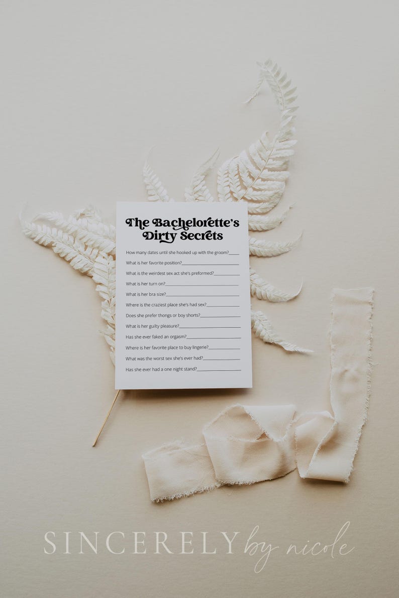 A bachelorette party game card titled "The Bachelorette’s Dirty Secrets" on a neutral background with white ferns and beige fabric. A fun and playful icebreaker featuring personal and cheeky questions.