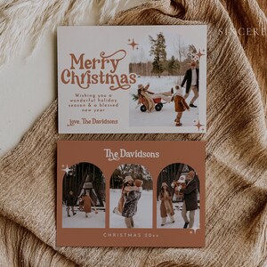 May include: A Christmas card with a photo of a family in a snowy setting. The card has a brown background with a white border and the text "Merry Christmas" in a festive font. The text "Wishing you a wonderful holiday season & a blessed new year" is also included, along with the family's name, "The Davidsons".