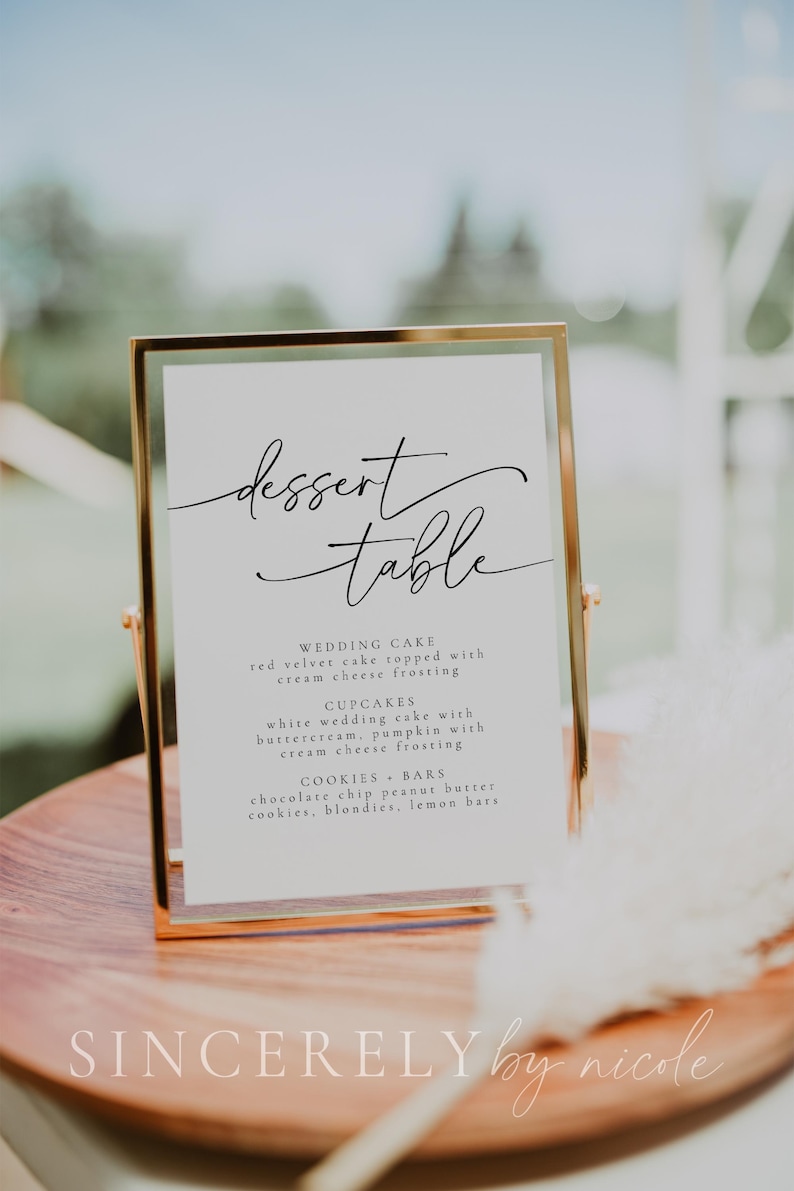 Elegant dessert table sign featuring a modern calligraphy design, listing wedding cake, cupcakes, and assorted cookies. A stylish display for receptions, bridal showers, or special events. A perfect touch for dessert buffets.
