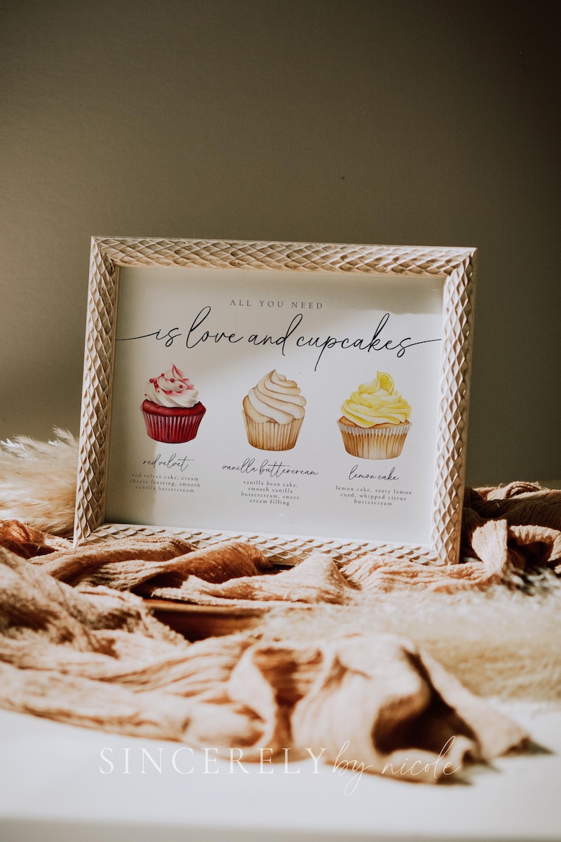 Modern wedding cupcake sign featuring red velvet, vanilla buttercream, and lemon cake options. A charming addition to a dessert spread.