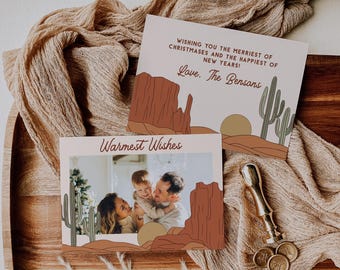 May include: A Christmas card with a desert landscape illustration featuring a family photo. The card reads "Wishing you the merriest of Christmases and the happiest of New Years! Love, The Bensons" and "Warmest Wishes".