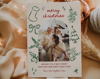 May include: A Christmas card with a photo of a family with their dog. The card has a green and red color scheme with a festive message that reads "merry christmas" and "WISHING YOU A VERY MERRY CHRISTMAS AND HAPPY NEW YEAR! love, the taylors 20xx".