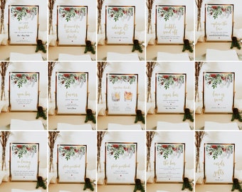 Könnte beinhalten: Ein Satz von 12 druckbaren Hochzeitsschildern mit einem winterlichen Blumendesign. Die Schilder haben goldenen Text und beinhalten Sätze wie "Let Love Sparkle", "Reserved for the Bride's Family", "Advice & Wishes", "Bubble Send Off", "Capture the Love", "Open Bar", "Favors", "Signature Drinks", "Cigar Bar", "Love is Sweet", "In Loving Memory", "Photo Guestbook", "Photo Guestbook", "The Bar", und "Cards & Gifts".