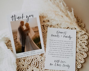 May include: A white thank you card with a photograph of a bride and groom in front of a sunset. The text on the card reads "Thank you" and "Amelia & Noah, September 13, 20xx | Boulder, Colorado". The back of the card has a message thanking friends and family for attending the wedding.