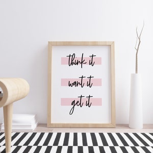 May include: A framed print with the text "think it want it get it" in black script on a white background. The text is underlined with pink horizontal lines.