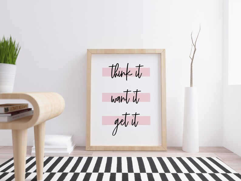 May include: A framed print with the text "think it want it get it" in black script on a white background. The text is underlined with pink horizontal lines.