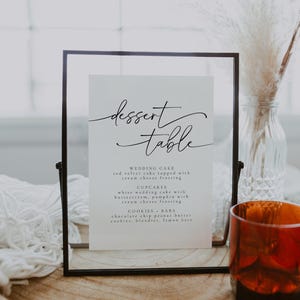 Sophisticated wedding dessert table sign with an elegant font, showcasing a selection of cakes, cupcakes, and bars. A timeless addition to any wedding, engagement party, or formal event, enhancing the dessert display.