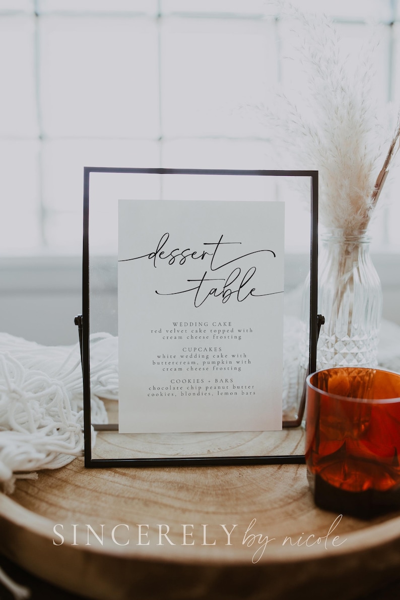Sophisticated wedding dessert table sign with an elegant font, showcasing a selection of cakes, cupcakes, and bars. A timeless addition to any wedding, engagement party, or formal event, enhancing the dessert display.