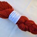 Handspun Organic Falkland Merino wool - 57 gram - blend of various shades of fiery orange/red