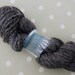 Handspun yarn - alpaca, merino and silk - 77 grams - mix of slate grey and black