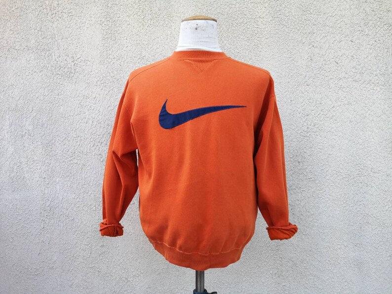 orange nike sweater