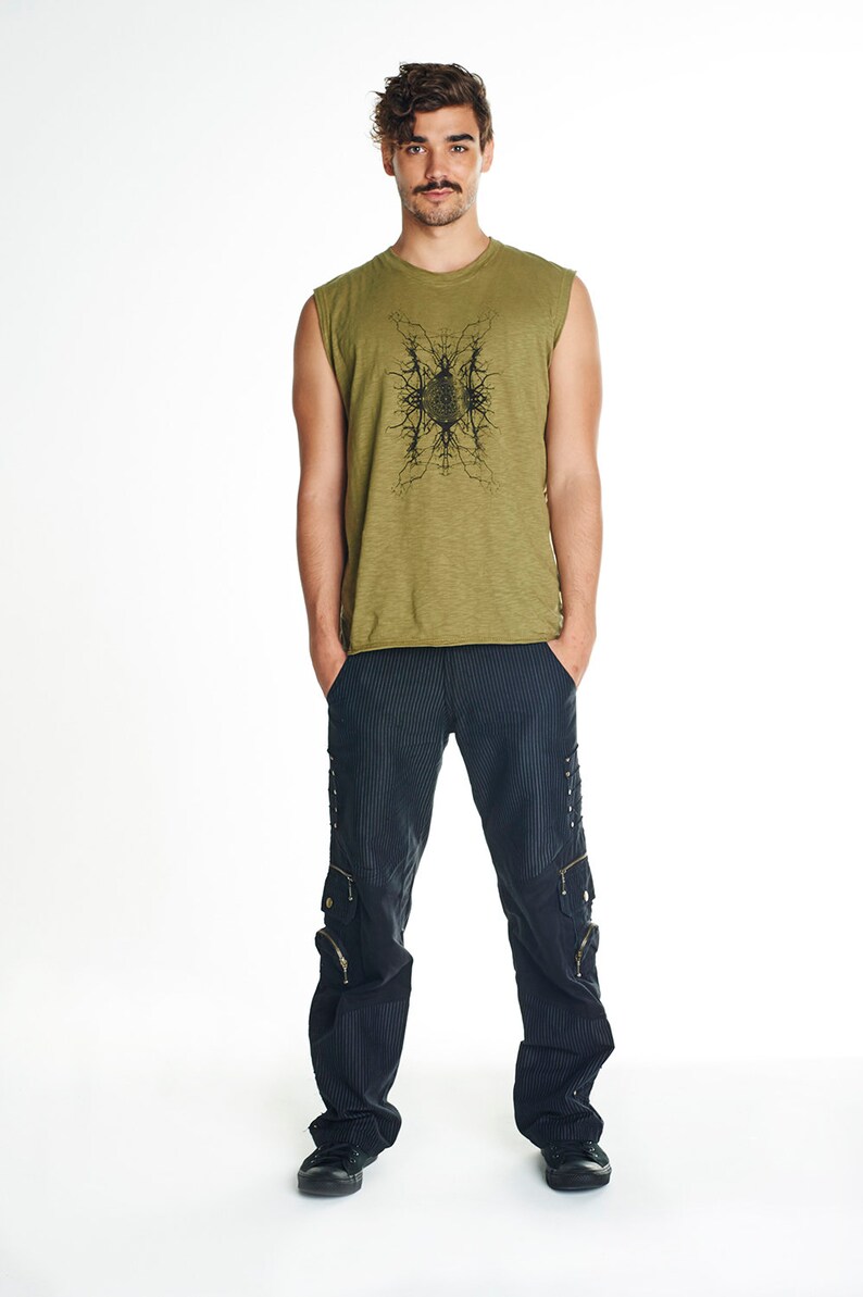 May include: A man is wearing a green sleeveless shirt with a black graphic print and black cargo pants.
