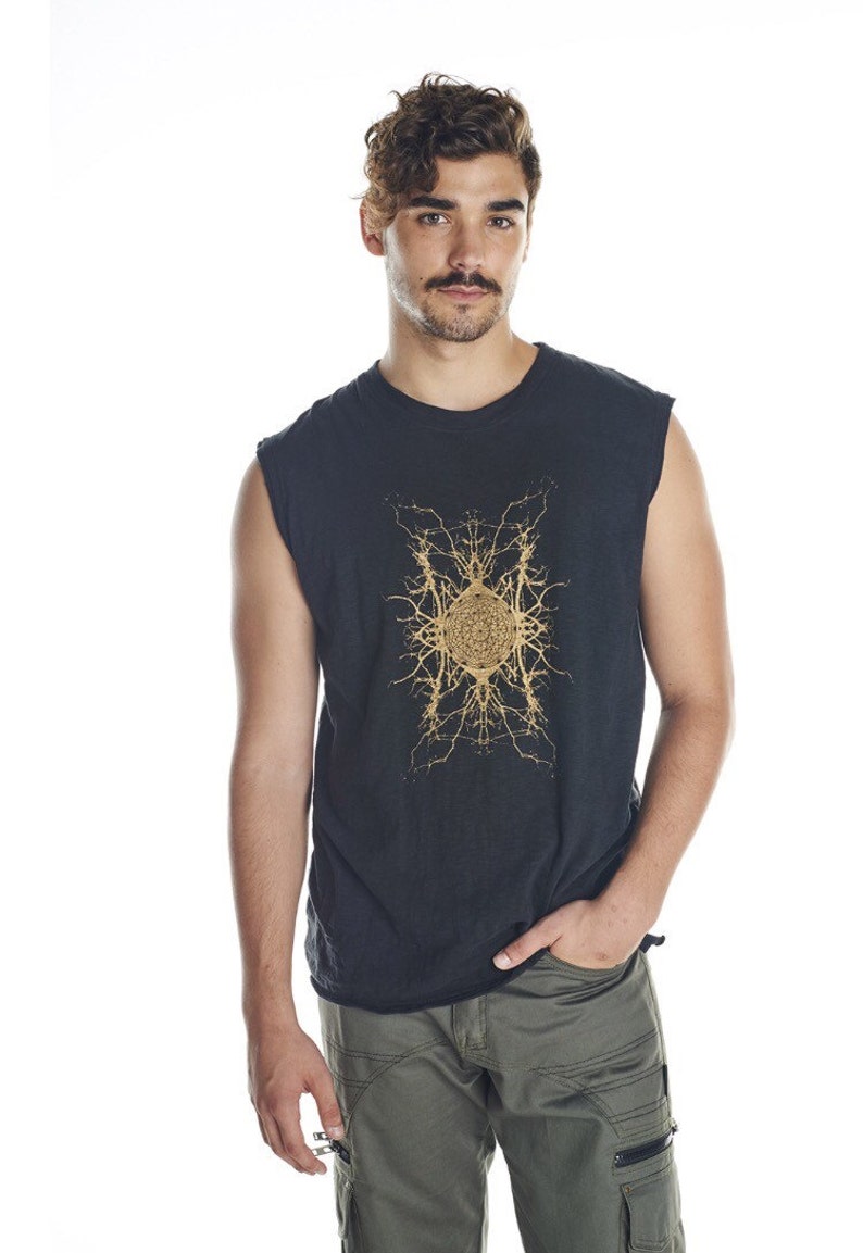 May include: A black sleeveless shirt with a gold geometric design. The design features a central circle surrounded by intricate lines.