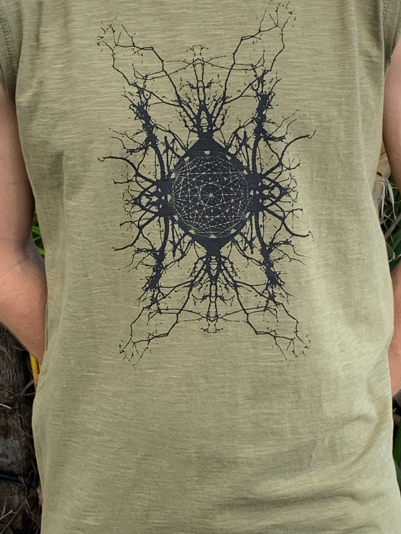 May include: A green sleeveless shirt with a black graphic print of a geometric design with a circle in the center.