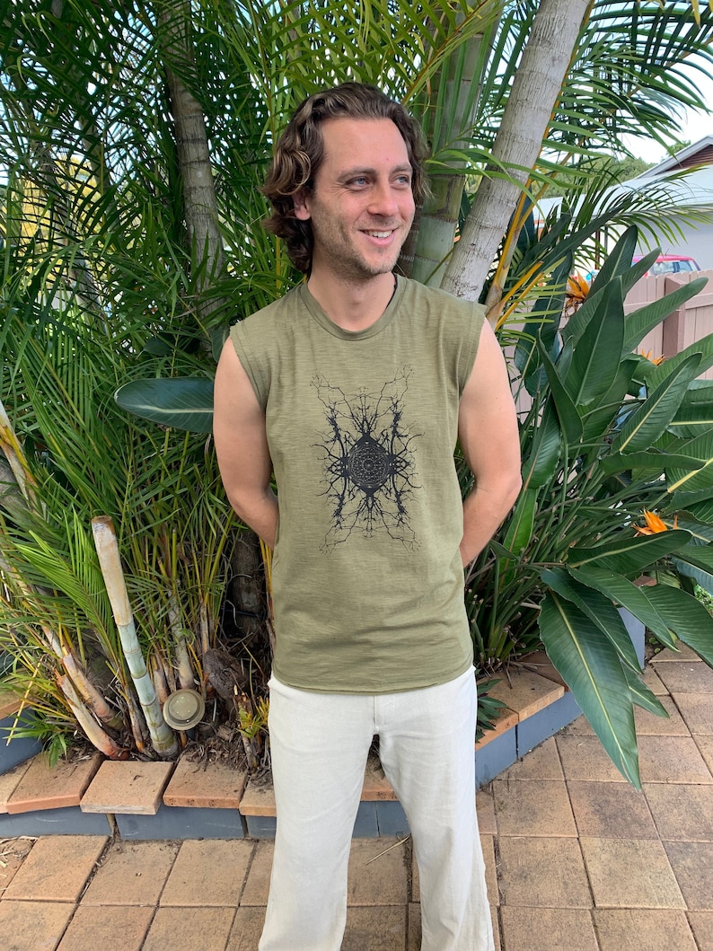 May include: A green sleeveless shirt with a black graphic print of a tree with roots and branches. The shirt is made of a soft, comfortable fabric.
