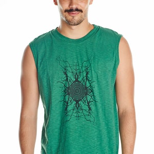 May include: A green sleeveless shirt with a black graphic print of a circular design with branches extending outward.