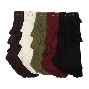 May include: Five ruffled skirts in different colors: brown, cream, olive green, burgundy, and black. Each skirt has a row of gold buttons at the top.