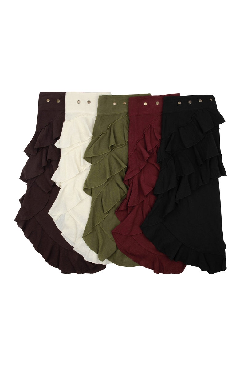 May include: Five ruffled skirts in different colors: brown, cream, olive green, burgundy, and black. Each skirt has a row of gold buttons at the top.