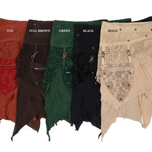 May include: A collection of colorful, layered skirts in various shades including brown, tan, full brown, green, black, and beige. Each skirt features a unique design with lace, pockets, and metal accents. The skirts are displayed against a white background.