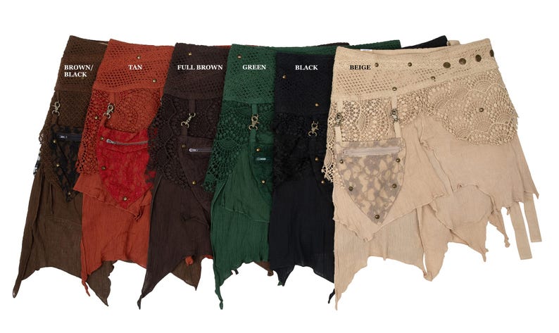May include: A collection of colorful, layered skirts in various shades including brown, tan, full brown, green, black, and beige. Each skirt features a unique design with lace, pockets, and metal accents. The skirts are displayed against a white background.