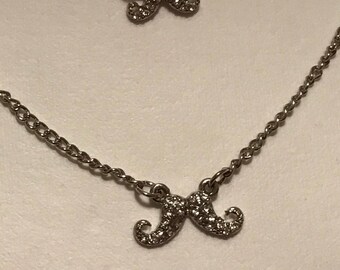 Triple strand mustache necklace