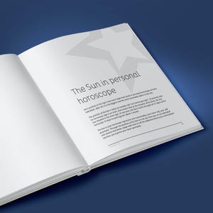 May include: A white book with a gray star on the cover. The title of the book is "The Sun in Personal Horoscope". The text on the page discusses the importance of the sun's position in a person's horoscope.