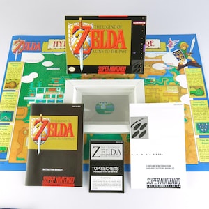 Zelda A Link to the Past - Super Nintendo - USA - Confezione completa, manuale, libro di suggerimenti, poster, vassoio interno (senza gioco)
