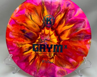 Kastaplast Grym X dyed disc golf disc, 12 5 0 3 , K1 Line plastic, 174 grams, used condition, some scuffing.