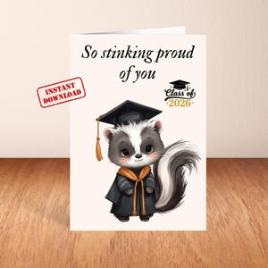 May include: A graduation card featuring a cartoon skunk wearing a graduation cap and gown. The card reads "So stinking proud of you" and "Class of 2026". An "Instant Download" stamp is in the corner.