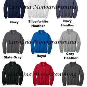 May include: A collection of quarter-zip sweatshirts in various colors, including navy, silver/white heather, slate gray, royal blue, gray heather, black, red, and black heather. Each sweatshirt features a zipper and the text "Carolina Monogramming".