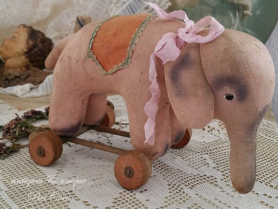 1910 stuffed elephant on wheels
