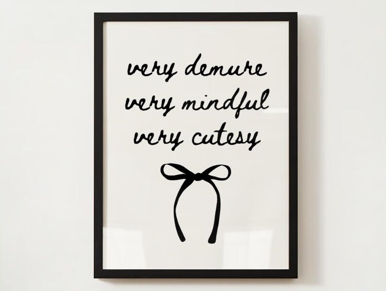 May include: Black and white printable art print with the text "very demure very mindful very cutesy" and a black bow.