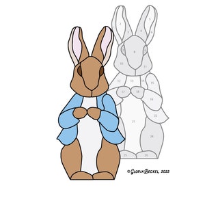 May include: A colour-by-number stained glass pattern of Peter Rabbit, a cartoon rabbit wearing a blue jacket. The pattern is numbered 1 through 26.