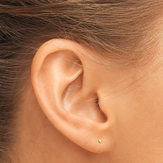 Small gold studs for ears deals