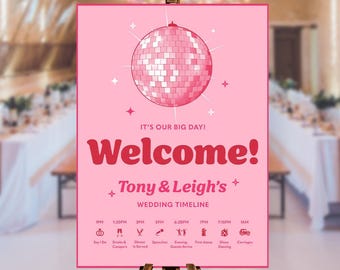May include: A rectangular pink wedding welcome sign featuring a large disco ball graphic at the top. The text reads: IT'S OUR BIG DAY! Welcome! Tony & Leigh's WEDDING TIMELINE, followed by a schedule of events from 1PM to 1AM with icons for each.